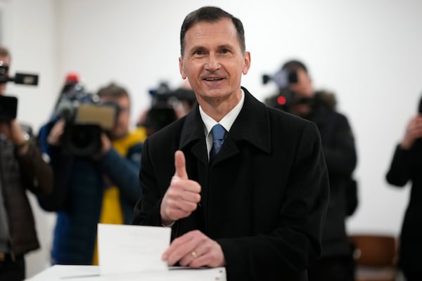 Presidential candidate Dragan Primorac casts his ballot during a runoff vote for the Croatian presidential election at a polling station in Zagreb, Croatia, Sunday, Jan. 12, 2025. (AP Photo/Darko Bandic)