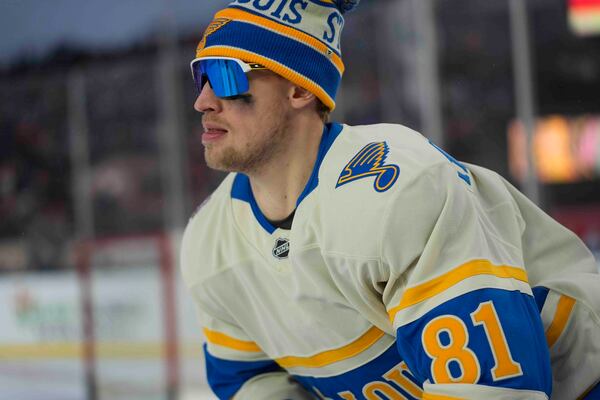 St. Louis Blues center Dylan Holloway (81) warms up before the NHL Winter Classic outdoor hockey game featuring the Chicago Blackhawks and Blues at Wrigley Field, Tuesday, Dec. 31, 2024, in Chicago. (AP Photo/Erin Hooley)