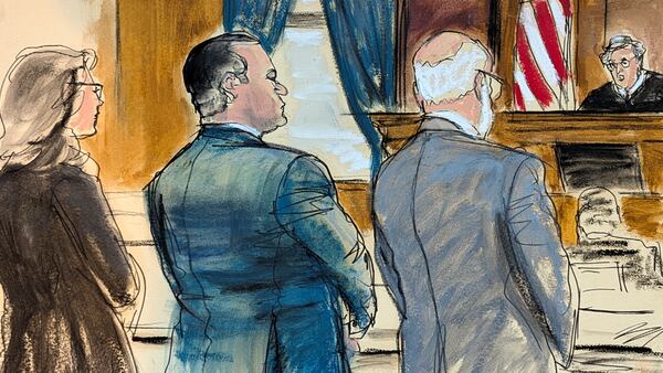 In this courtroom sketch, Wael Hana, center, co-defendant of former Sen. Bob Menendez stands during his sentencing in Manhattan federal court, Wednesday, Jan. 29, 2025, in New York. (Elizabeth Williams via AP)