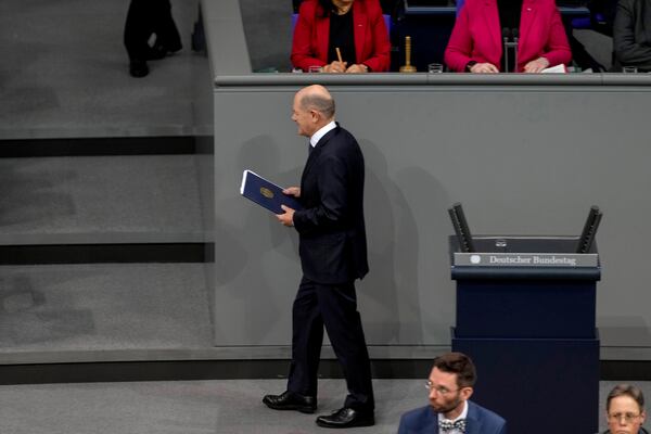 German Chancellor Olaf Scholz leaves after his speech during a plenary session at the German parliament Bundestag where he faces a vote of confidence, Berlin, Germany, Monday, Dec. 16, 2024. (AP Photo/Markus Schreiber)