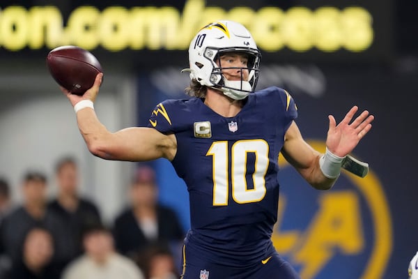 Los Angeles Chargers quarterback Justin Herbert (10) throws a pass during the first half of an NFL football game against the Baltimore Ravens, Monday, Nov. 25, 2024, in Inglewood, Calif. (AP Photo/Eric Thayer)