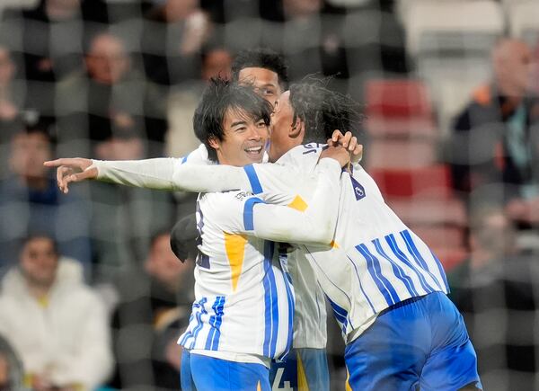 Brighton & Hove Albion's Kaoru Mitoma celebrates scoring their side's second goal during the English Premier League soccer match between Bournemouth and Brighton & Hove Albion, at the Vitality Stadium, Bournemouth, England, Saturday Nov. 23, 2024. (Andrew Matthews/PA via AP)