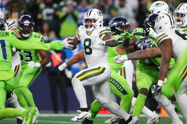 Green Bay Packers' Josh Jacobs runs during the first half of an NFL football game against the Seattle Seahawks Sunday, Dec. 15, 2024, in Seattle. (AP Photo/Lindsey Wasson)