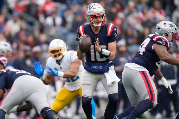 New England Patriots quarterback Drake Maye (10) looks to pass against the Los Angeles Chargers during the first half of an NFL football game, Saturday, Dec. 28, 2024, in Foxborough, Mass. (AP Photo/Robert F. Bukaty)