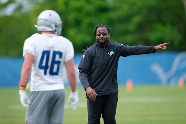 FILE - Detroit Lions linebacker coach Kelvin Sheppard gives instruction to linebacker Jack Campbell (46) during an NFL football rookie minicamp practice in Allen Park, Mich., Saturday, May 13, 2023. (AP Photo/Paul Sancya, File)