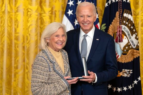 President Joe Biden awards the Presidential Citizens Medal to Cynthia Baker on behalf of Nancy Kassebaum during a ceremony in the East Room at the White House, Thursday, Jan. 2, 2025, in Washington. (AP Photo/Mark Schiefelbein)