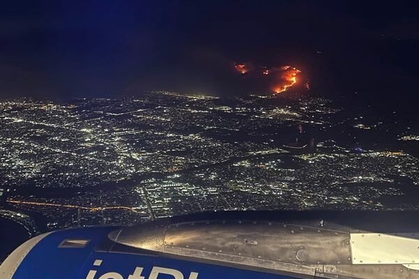 This photo provided by Shania Accius shows the wildfires from a JetBlue flight from New York City to LAX early Wednesday, Jan. 8, 2025 in Los Angeles. (Shania Accius via AP)