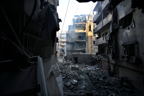 Destroyed buildings are seen at the site of an Israeli airstrike that hit central Beirut, Lebanon, Saturday, Nov. 23, 2024. (AP Photo/Hassan Ammar)