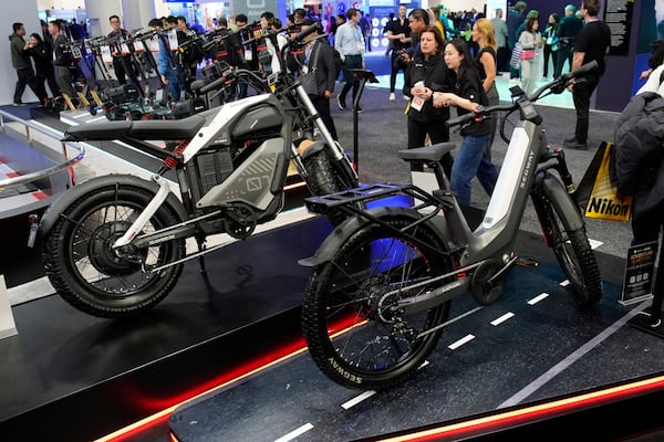 The Segway Xafari, right and Xyber e-bikes sit on display during the CES tech show Tuesday, Jan. 7, 2025, in Las Vegas. (AP Photo/John Locher)