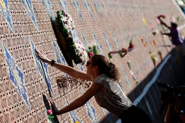 A relative of victim of a 2004 Indian Ocean tsunami participates in its 20th anniversary at Tsunami Memorial Park at Ban Nam Khem, Takuapa district of Phang Nga province, southern Thailand, Thursday, Dec. 26, 2024. (AP Photo/Wason Wanichakorn)