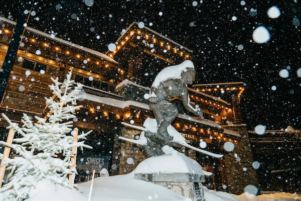 In this photo provided by Mammoth Mountain, snow piles up on a statue during a storm Sunday, Nov. 24, 2024, in Mammoth Lakes, Calif. (Cody Mathison/Mammoth Mountain via AP)