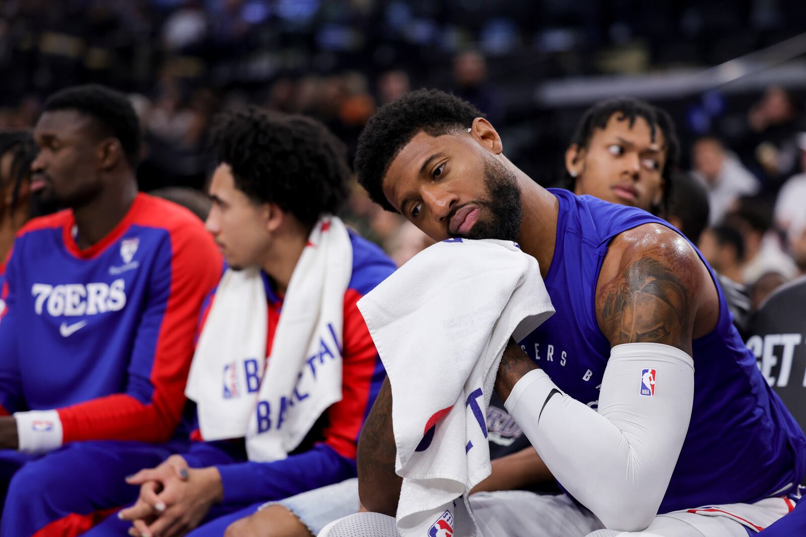 Philadelphia 76ers forward Paul George sits on the bench during the first half of an NBA basketball game against the Los Angeles Clippers, Wednesday, Nov. 6, 2024, in Inglewood, Calif. (AP Photo/Ryan Sun)