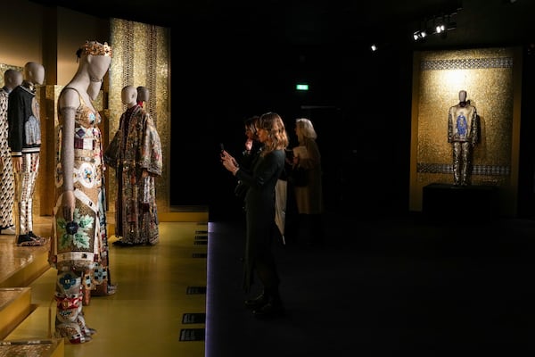 Creations are displayed during the exhibition "From the Heart to the Hands: Dolce&Gabbana" at the Grand Palais, in Paris, Thursday, Jan. 9, 2025. (AP Photo/Thibault Camus)