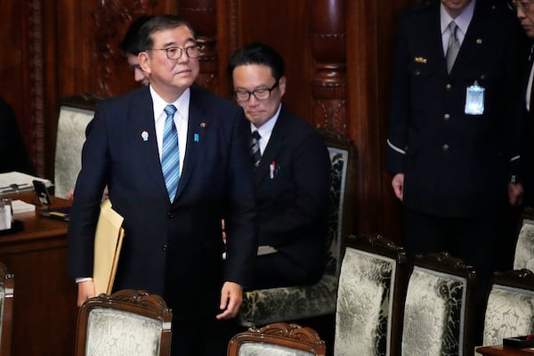 Japan's Prime Minister Shigeru Ishiba arrives to deliver a policy speech marking the start of this year's parliamentary session in Tokyo, Friday, Jan. 24, 2025. (AP Photo/Eugene Hoshiko)