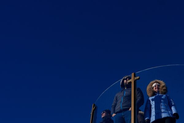 People observe the New York skyline from Top of the Rock's Skylift, Friday, Dec. 13, 2024, in New York. (AP Photo/Julia Demaree Nikhinson)