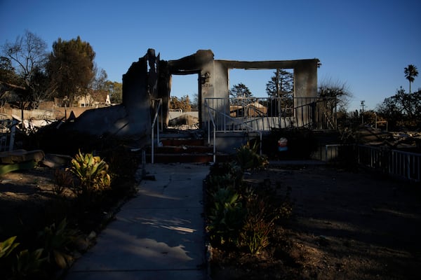 Part of a home destroyed by the Eaton Fire still stands, Tuesday, Jan. 14, 2025, in Altadena, Calif. (AP Photo/John Locher)