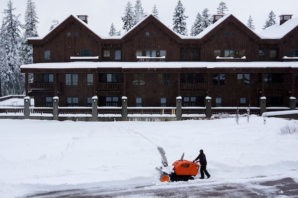 A worker clears a road with a snow blower during a storm Thursday, Nov. 21, 2024, at Sugar Bowl Ski Resort in Norden, Calif. (AP Photo/Brooke Hess-Homeier)