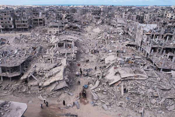 An aerial photograph taken by a drone shows displaced Palestinians returning to Rafah, a day after the ceasefire deal between Israel and Hamas came into effect, Gaza Strip, Monday, Jan. 20, 2025. (AP Photo/Mohammad Abu Samra)