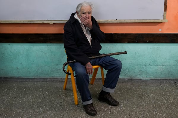 Uruguay's former President Jose "Pepe" Mujica sits inside a polling station while waiting to vote in the presidential run-off election in Montevideo, Uruguay, Sunday, Nov. 24, 2024.(AP Photo/Natacha Pisarenko)