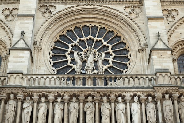 Part of the facade of Notre-Dame Cathedral is seen in Paris, Friday Nov., 29 2024 ahead of French President Emmanuel Macron's final visit to the construction site to see the restored interiors before the iconic monument's reopening for worship on Dec. 8. (Christophe Petit Tesson, Pool via AP)