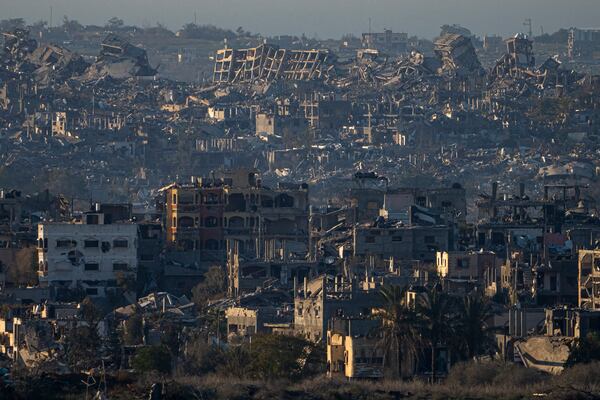 Destroyed buildings are seen inside the Gaza Strip from southern Israel, Monday, Jan. 13, 2025. (AP Photo/Ariel Schalit)