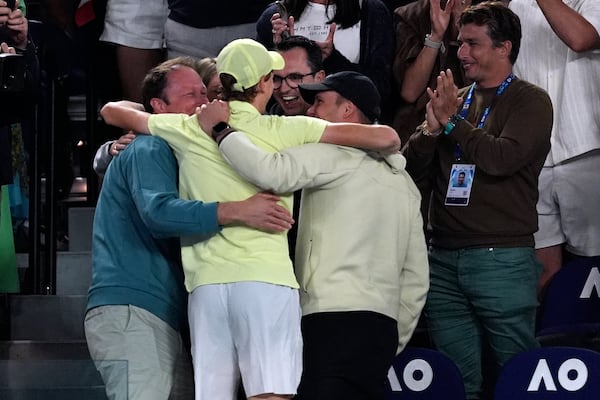 Jannik Sinner of Italy celebrates with supporters after defeating Alexander Zverev of Germany in the men's singles final at the Australian Open tennis championship in Melbourne, Australia, Sunday, Jan. 26, 2025. (AP Photo/Ng Han Guan)