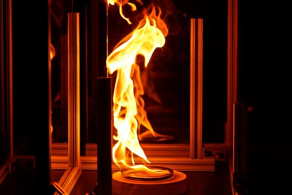 Flames leap during a controlled burn in a lab at Worcester Polytechnic Institute, Wednesday, Jan. 15, 2025, in Worcester, Mass. (AP Photo/Robert F. Bukaty)