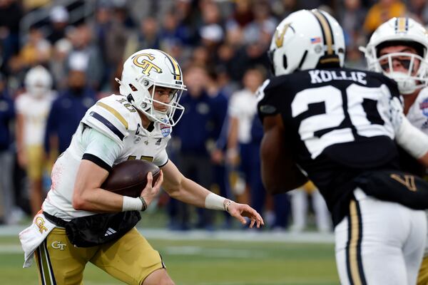 Georgia Tech quarterback Haynes King (10) carries the ball against Vanderbilt during the first half of the Birmingham Bowl NCAA college football game, Friday, Dec. 27, 2024, in Birmingham, Ala. (AP Photo/Butch Dill)