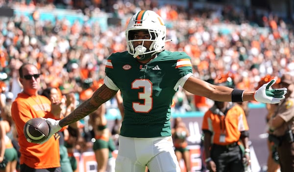 Miami wide receiver Jacolby George (3) reacts after scoring a touchdown during the first half of an NCAA college football game against against Wake Forest, Saturday, Nov. 23, 2024, in Miami Gardens, Fla. (AP Photo/Lynne Sladky)