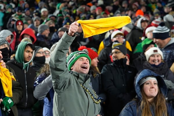 Notre Dame fans celebrate during the second half in the first round of the NCAA College Football Playoff against Indiana, Friday, Dec. 20, 2024, in South Bend, Ind. (AP Photo/Darron Cummings)