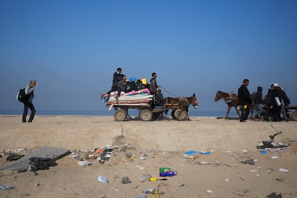 Displaced Palestinians walk on a road in central Gaza to return to their homes in the northern Gaza Strip, Wednesday, Jan. 29, 2025. (AP Photo/Abdel Kareem Hana)