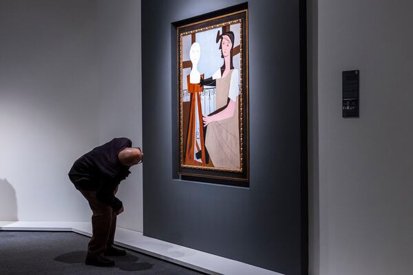 A man takes a look at "La Statuaire," by Pablo Picasso, during an auction preview at Sotheby's in New York, Monday, Nov, 11, 2024. (AP Photo/Eduardo Munoz Alvarez)