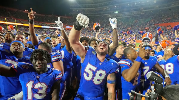 Florida players celebrate in front of fans after defeating LSU in an NCAA college football game, Saturday, Nov. 16, 2024, in Gainesville, Fla. (AP Photo/John Raoux)