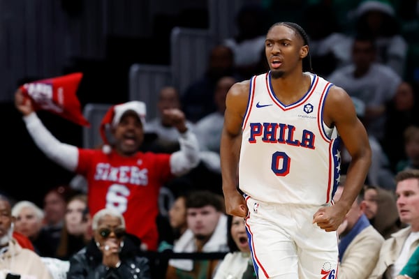 Philadelphia 76ers' Tyrese Maxeyn (0) celebrates his three-pointer against the Boston Celtics during the first half of an NBA basketball game, Wednesday, Dec. 25, 2024, in Boston (AP Photo/Michael Dwyer)