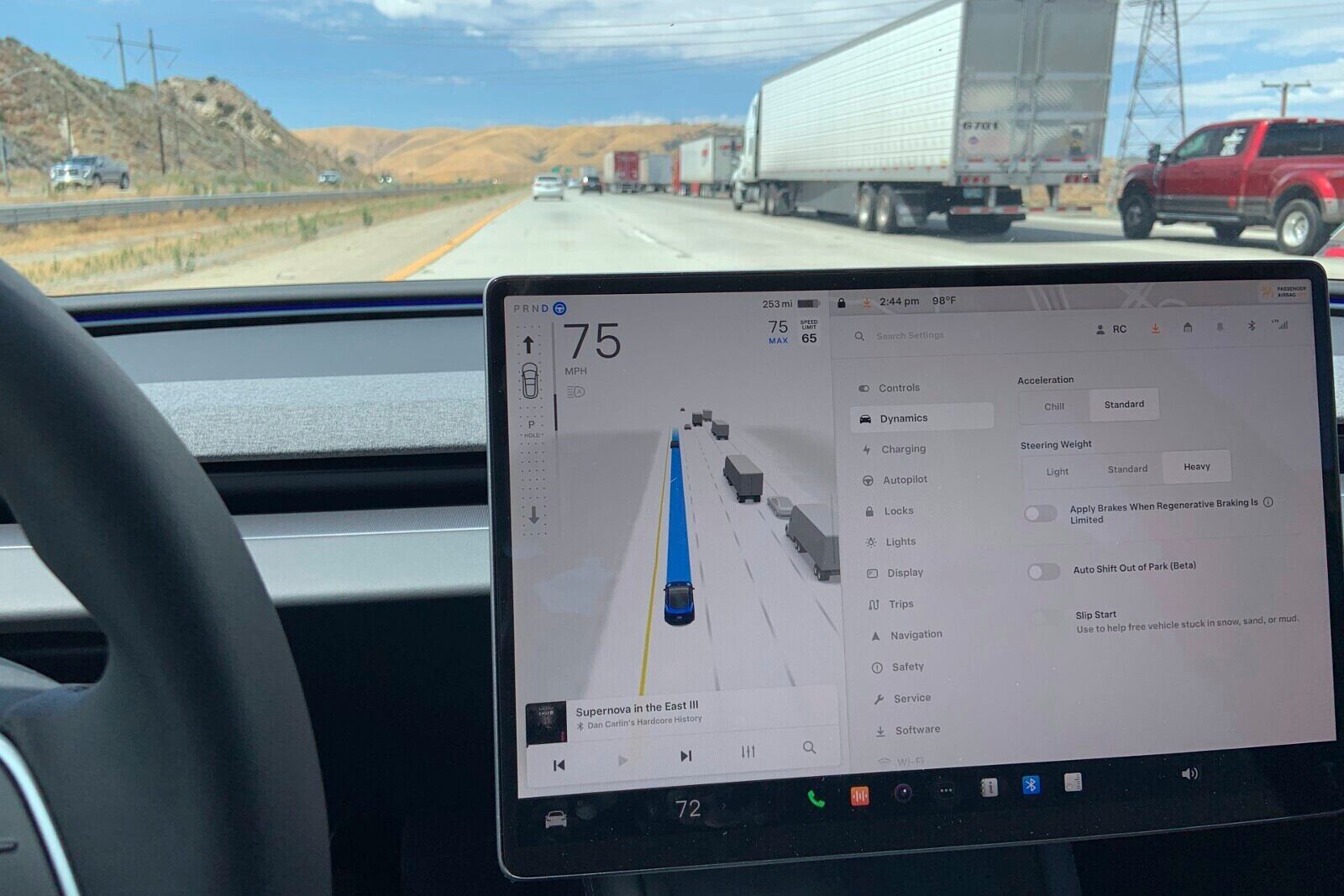 This photo provided by Edmunds shows an adaptive cruise system operating on a Tesla Model 3. Adaptive cruise holds a constant speed and can also slow or accelerate the vehicle. (Courtesy of Edmunds via AP)