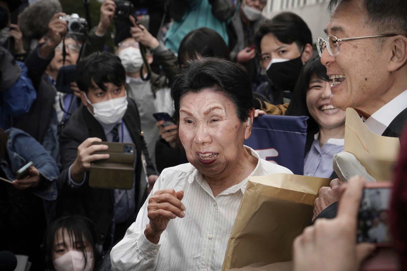 Hideko Hakamada, sister of former boxer Iwao Hakamada who has been on death row for the 1966 murder case, weeps after Tokyo High Court ordered a retrial for her brother, in front of the court in Tokyo, on March 13, 2023. Japanese prosecutors said on Oct. 8, 2024 they will not appeal the Sept. 26 ruling of the Shizuoka District Court that acquitted the world’s longest-serving death-row inmate in a retrial. (Kyodo News via AP)