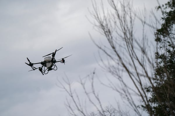 Russell Hedrick's DJI drone puts crop cover on his farm, Tuesday, Dec. 17, 2024, in Hickory, N.C. (AP Photo/Allison Joyce)