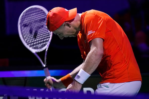 Netherlands' Tallon Griekspoor reacts as he plays Italy's Jannik Sinner during the Davis Cup final tennis match between Netherlands and Italy at the Martin Carpena Sports Hall in Malaga, southern Spain, Sunday, Nov. 24, 2024. (AP Photo/Manu Fernandez)