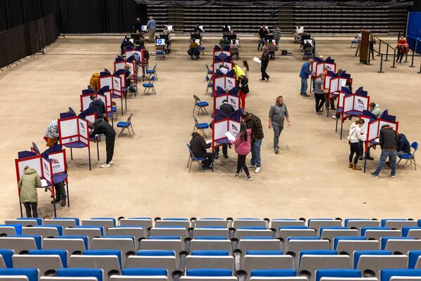 Voters fill out ballots at voting booths inside the Bismarck Event Center during Election Day Tuesday, Nov. 5, 2024, in Bismarck, N.D. (Tanner Ecker/The Bismarck Tribune via AP)