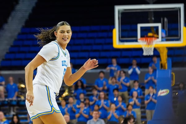 UCLA center Laurent Betts (51) reacts after scoring against Pepperdine during the second half of a women's NCAA college basketball game Tuesday, Nov. 12, 2024, at Pauley Pavilion in Los Angeles. (AP Photo/Damian Dovarganes)