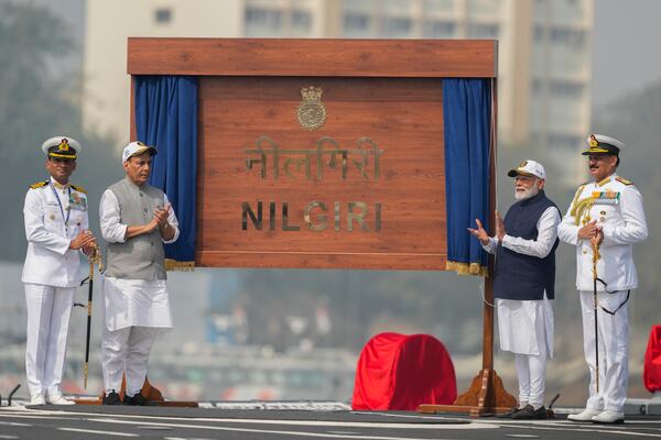 From right to left, India's Navy Chief Dinesh Kumar Tripathi, Indian Prime Minister Narendra Modi, and Indian Defense Minister Rajnath Singh, are seen on the deck of INS Nilgiri during during its commissioning ceremony at a naval dockyard in Mumbai, India, Wednesday, Jan. 15, 2025. (AP Photo/Rafiq Maqbool)