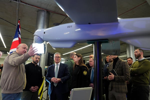 British Prime Minister Keir Starmer, 3rd left, and Ukrainian President Volodymyr Zelenskyy, 2nd left, attend a presentation of Ukrainian military drones at an undisclosed location in Kyiv, Ukraine, Thursday, Jan. 16, 2025. (Carl Court, Pool Photo via AP)