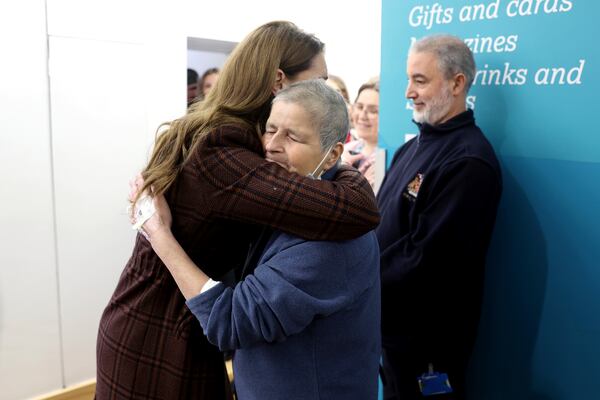 Britain's Princess Kate, left, hugs Rebecca Mendelhson during a visit to The Royal Marsden Hospital, where she received her cancer treatment, in London, Tuesday Jan. 14, 2025 in London, England. (Chris Jackson/Pool Photo via AP)