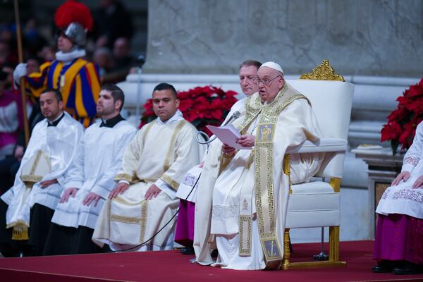 Pope Francis presides over the Christmas Eve Mass in St. Peter's Basilica at The Vatican, Tuesday, Dec. 24, 2024, after opening the basilica's holy door marking the start of the Catholic jubilar year 2025. (AP Photo/Andrew Medichini)