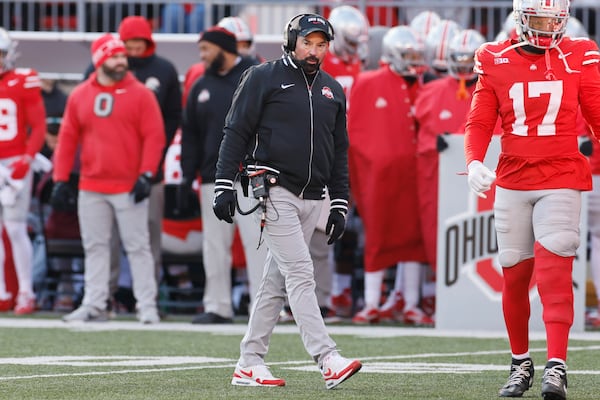 Ohio State head coach Ryan Day, center, looks on during the second half of an NCAA college football game against Michigan, Saturday, Nov. 30, 2024, in Columbus, Ohio. (AP Photo/Jay LaPrete)