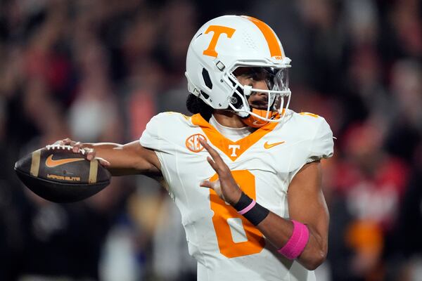 Tennessee quarterback Nico Iamaleava (8) thros a pass during the first half of an NCAA college football game against Georgia, Saturday, Nov. 16, 2024, in Athens, Ga. (AP Photo/John Bazemore)