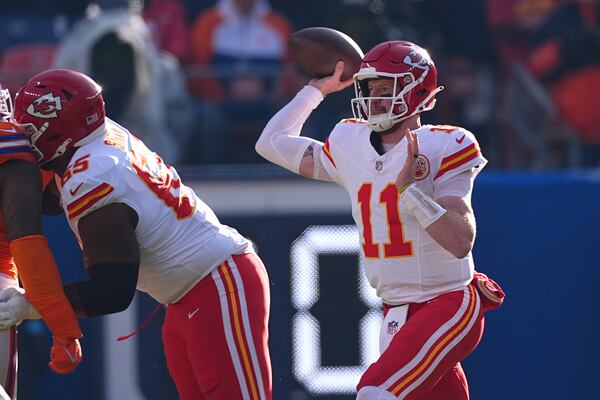 Kansas City Chiefs quarterback Carson Wentz throws during the first half of an NFL football game against the Denver Broncos Sunday, Jan. 5, 2025, in Denver. (AP Photo/David Zalubowski)