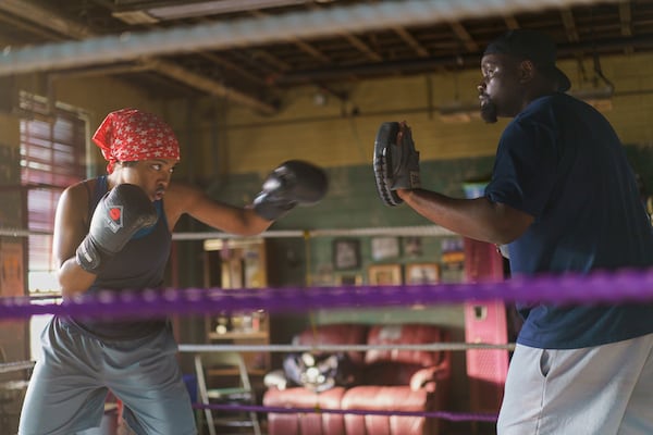 This image released by Amazon Content Services shows Ryan Destiny as Claressa Shields, left, and Brian Tyree Henry as Jason Crutchfield in a scene from "The Fire Inside." (Sabrina Lantos/Amazon Content Services via AP)