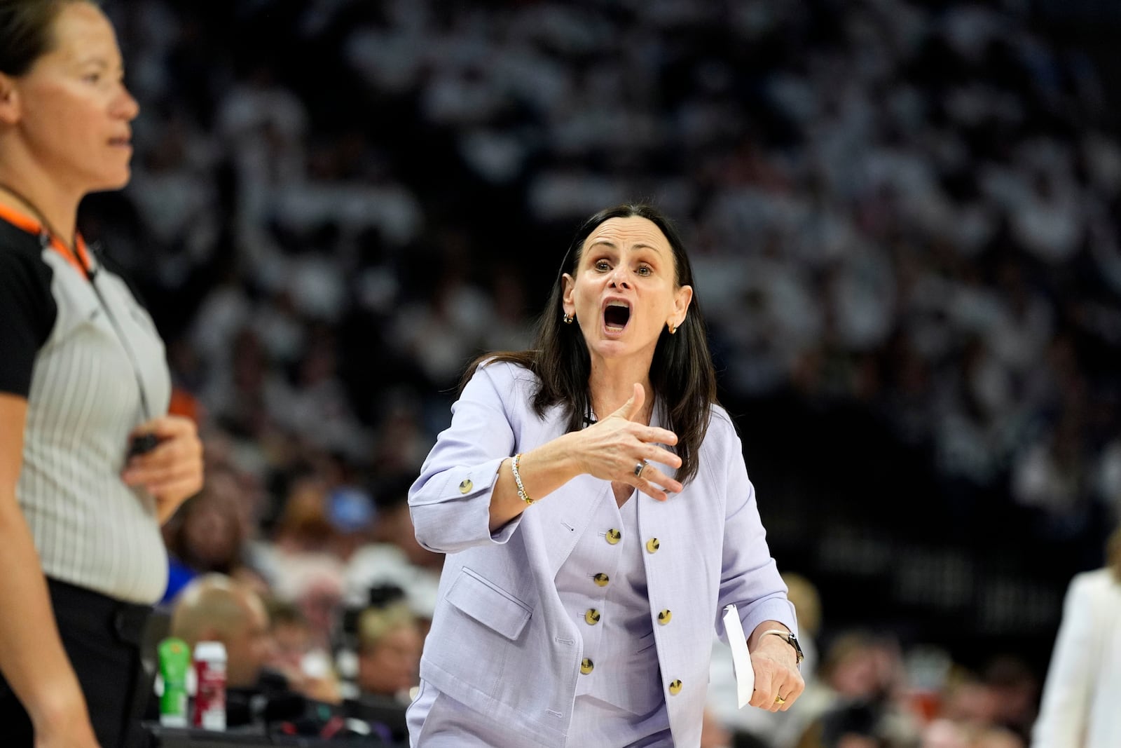 New York Liberty head coach Sandy Brondello reacts to a call during the first half against the Minnesota Lynx in Game 3 of a WNBA basketball final playoff series, Wednesday, Oct. 16, 2024, in Minneapolis. (AP Photo/Abbie Parr)