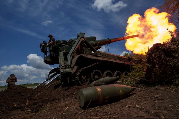 FILE - Ukrainian soldiers fire toward Russian positions at the front line in Donetsk region, Ukraine, Monday, June 24, 2024. (AP Photo/Evgeniy Maloletka, File)